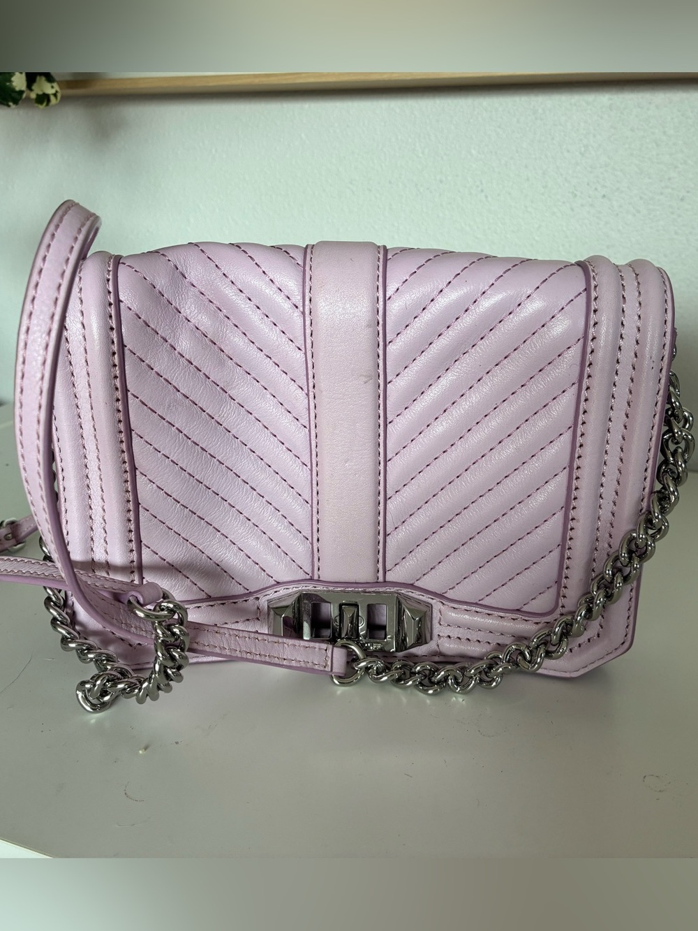 Rebecca Minkoff Lilac purse with silver chain.